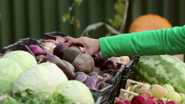 Buying beets in the Market.  2 Shots.