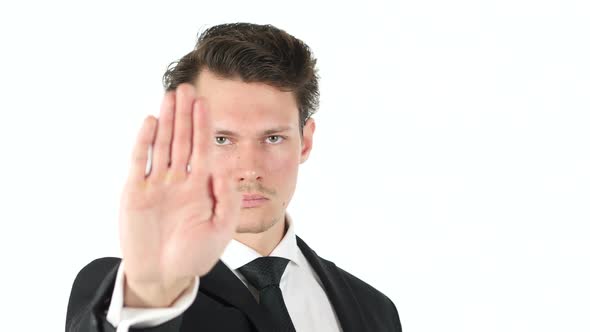 Stop Gesture By Businessman on White Background