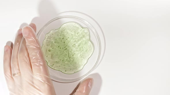 Petri Dishes with Cosmetics Samples on a White Background alt