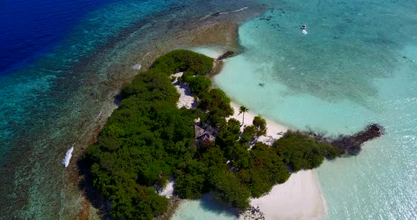 Beautiful above abstract view of a white sand paradise beach and aqua blue ocean background in colou