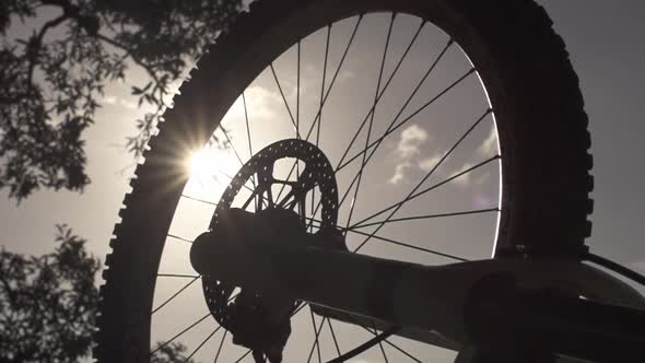Silhouette Slow-mo of Mountain Bike Wheel