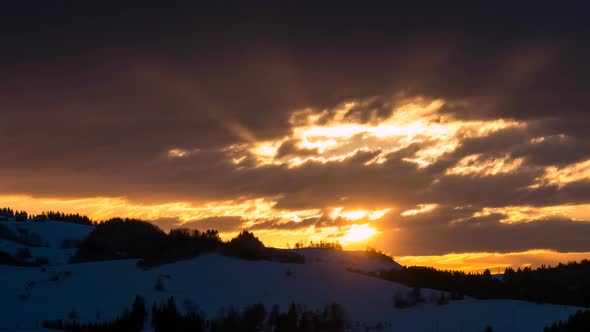 Colorful Sunrise Morning with Clouds Sky and Sunbeam in Winter Nature Landscape Time lapse