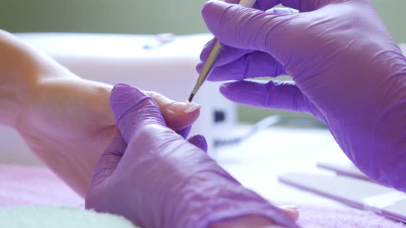 Detailed Frech nail manicure treatment in the salon details of process 4K 2160p 30fps UltraHD video  alt