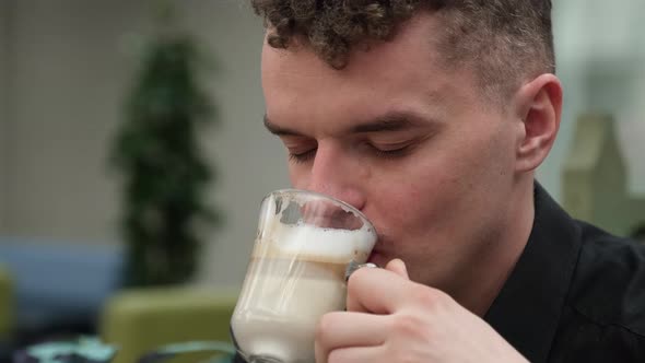 Cool Young Hipster Drinking Cappuccino