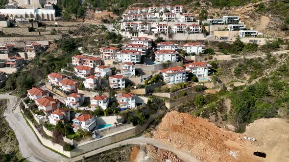 Complex of villas in the mountains aerial view 4 K