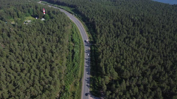 Flight to the Lighthouse Over the Road and Forest