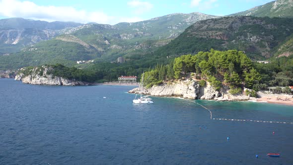 Panoramic View From the Sea to Villa Milocer Against the Backdrop of Green Mountains