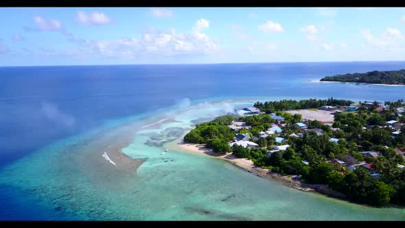 Aerial drone travel of paradise coast beach vacation by turquoise water with clean sand background o