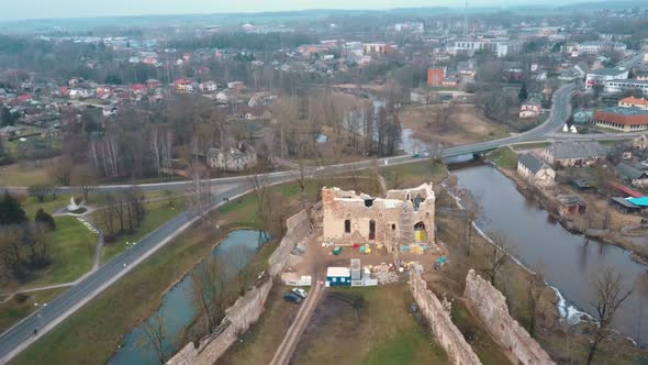 Medieval Castle the Town of Dobele on the West Bank of the River Berze in Autumn. Aerial 4K Video