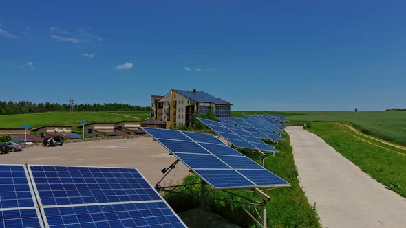 Row of solar cells on green grass