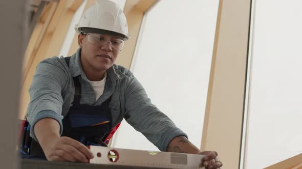 Worker Using Bubble Level