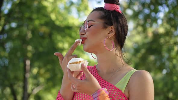 Young Coquette Caucasian Woman in Retro Clothes Tasting Sweet Delicious Doughnut Cream in Slow