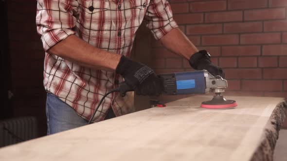 Close Up Shot of the Worker's Hands, Who Uses an Drill and a Grinding Nozzle