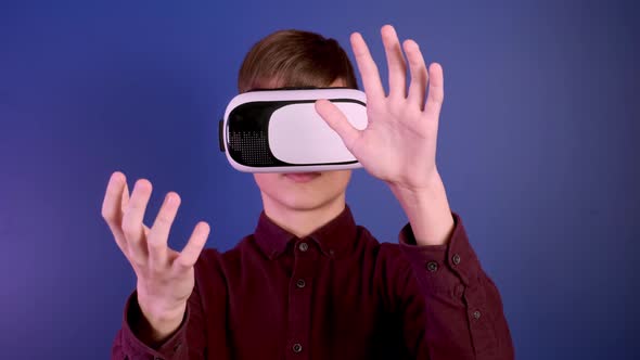 Child in Virtual Reality Helmet Gestures Controls