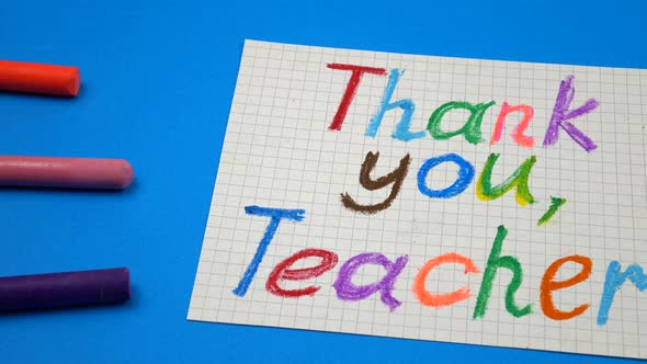 A greeting handwritten card with the gratitude to the teacher in honor of teacher's day