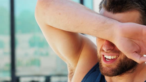 Portrait of Tired Young Man with Wet Face Outdoors