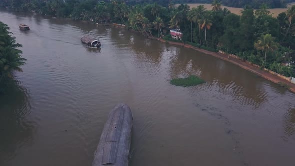 Houseboat tour of Kerala backwaters at Alleppey, India. Aerial drone view