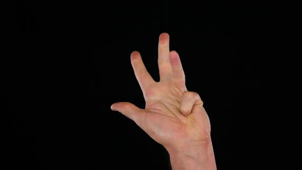 Male Hand Counting Five Fingers on Black Background