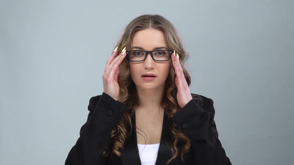 Bussines Girl in Glasses Looks in Surprise at Camera and Is Shocked By What She Saw, Slow Motion