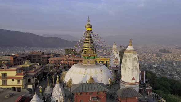 Flying in close to Swayambhunath Stupa viewing the prayer flags