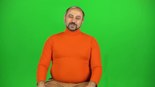 Caucasian Man with a Beard Rubs His Hands in Delight and Makes Gesture Perfect. Green Screen.