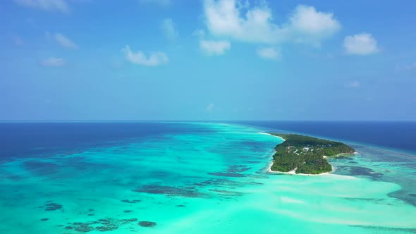 Wide drone copy space shot of a white paradise beach and aqua turquoise water background in colourfu