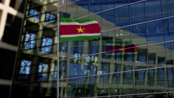 Suriname Flag Waving On A Skyscraper Building