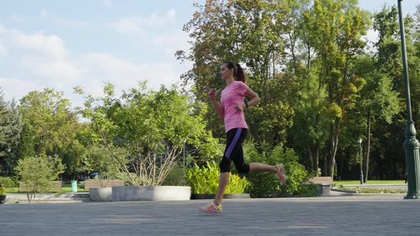 Slow Motion Woman Jogging in Public Park