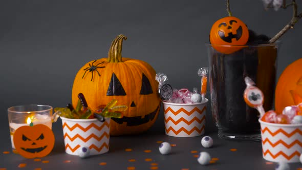 Pumpkins, Candies and Halloween Decorations
