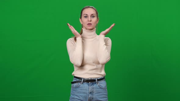 Young Woman Clapping Cheeks with Hands at Chromakey Background