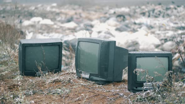 Thrown-out TVs at the Gardage Dump in the Snow