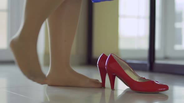 The Legs of the Girl Wear Red Shoes