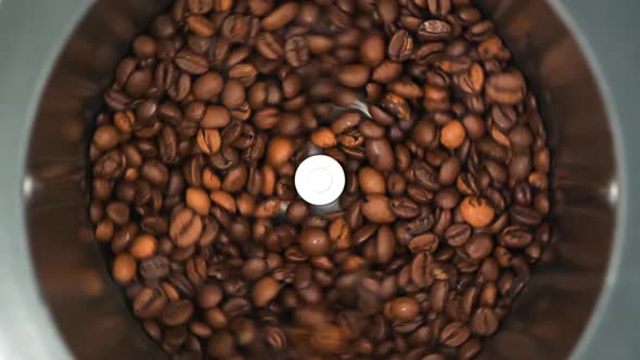 HD - Coffee grinder grinds coffee beans. Slow-mo	