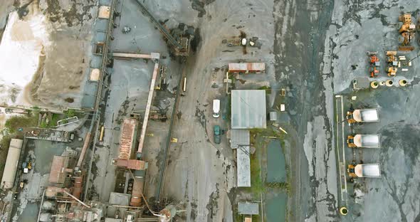 Aerial panorama view dumpers and machines are working in the quarry mine for special equipment