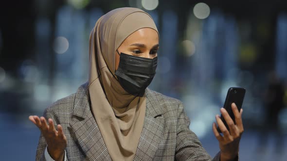 Female Portrait Outdoors Muslim Woman Islamic Girl Wears Hijab and Medical Mask in Evening City