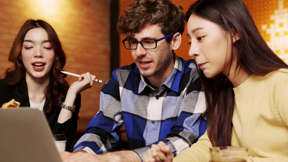 young asian woman and caucasian man Business people Working discuss finding new strategy