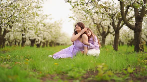 A Family in a Blossoming Spring Garden