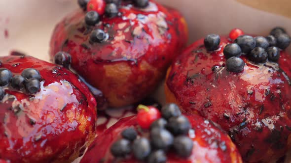 Close Up of Doughnuts with Berry Sauce in a Box. 