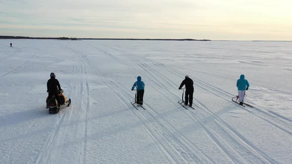 Kicksleds And Snowmobile On The Frozen Sea