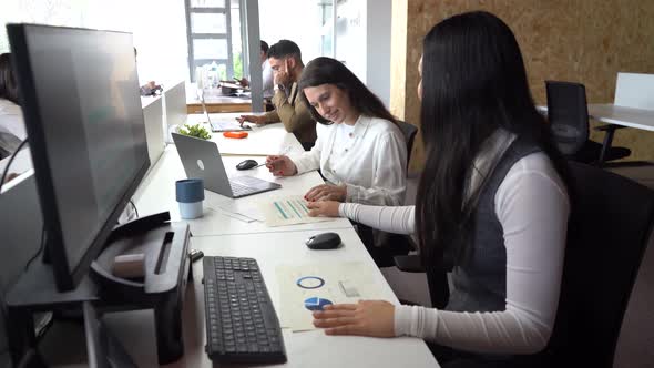 Women reading documents in office