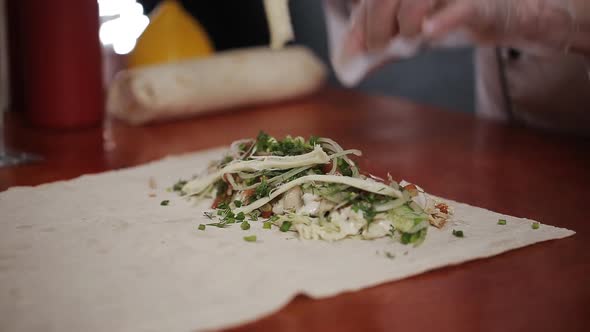 Hand Wrapping Traditional Shawarma with Beef and Vegetables