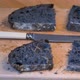 Artisan home-made charcoal sourdough bread freshly sliced with bread knife - VideoHive Item for Sale