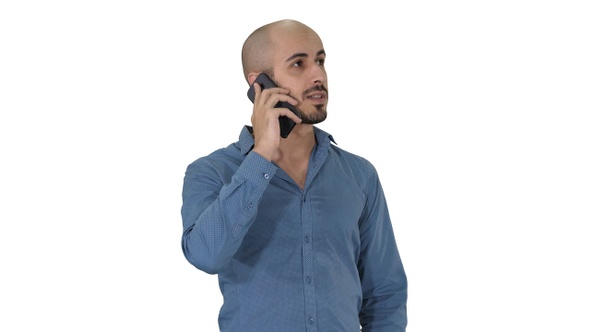 Arabic man talking on the phone on white background.