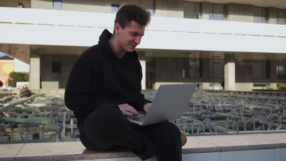 Guy Communicates on Video Call Using Laptop