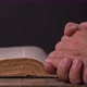 Man Praying With Hands Over Old Bible - VideoHive Item for Sale