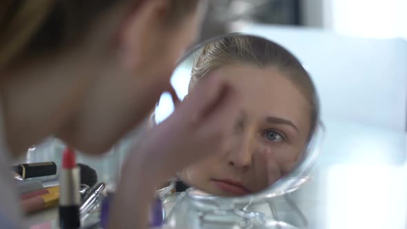 Girl Putting Concealer on Skin Masking Dark Circles Under Eyes, Beauty Procedure