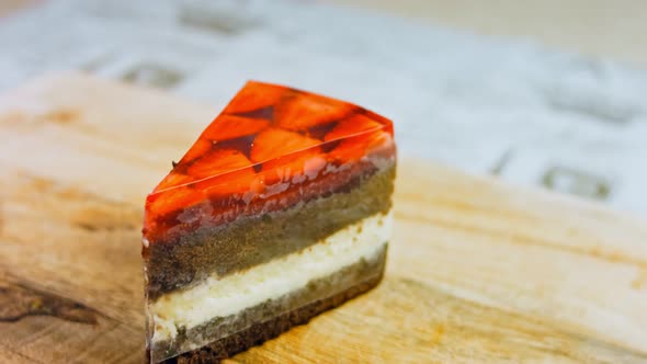 A Slice of Cake with Strawberries and Jelly