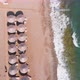 Flight Over the Beach with Umbrellas Towards the Pool in a Luxury Hotel - VideoHive Item for Sale