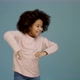 Cheerful little girl with curly hair jumping funny and dancing joyfully - VideoHive Item for Sale
