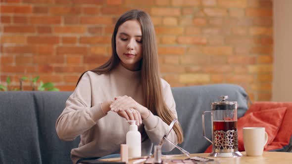 Young Millennial Woman Applying Moisturizing Cream Hands Enjoying Skincare Home Slow Motion
